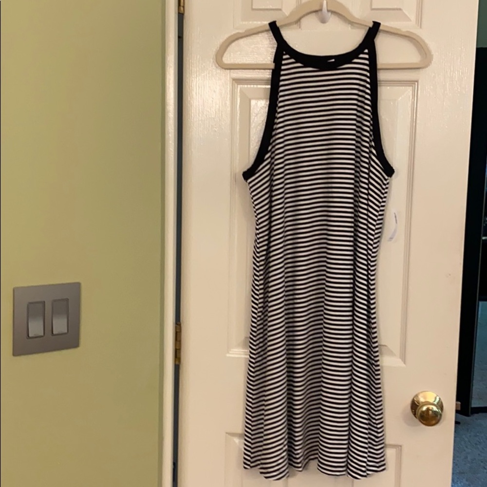High-neck sleeveless jersey-knit swing dress.